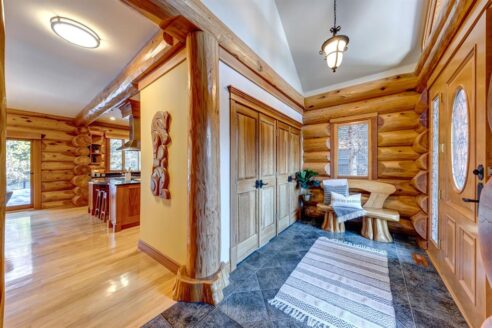 6361 Fairway Drive, interior and exterior views of this luxury log home.