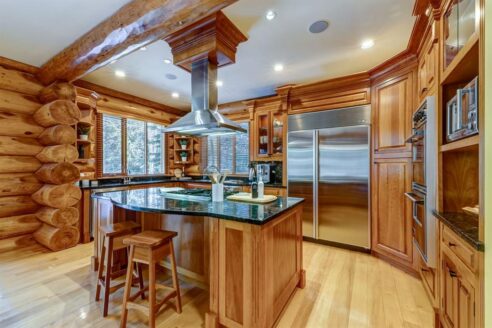 6361 Fairway Drive, interior and exterior views of this luxury log home.