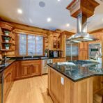 6361 Fairway Drive, interior and exterior views of this luxury log home.