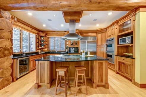 6361 Fairway Drive, interior and exterior views of this luxury log home.