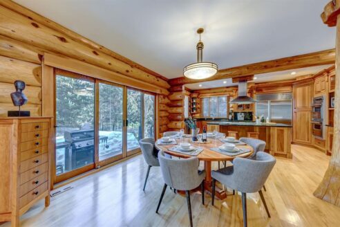 6361 Fairway Drive, interior and exterior views of this luxury log home.