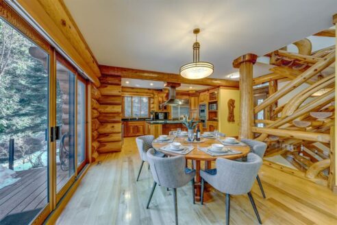 6361 Fairway Drive, interior and exterior views of this luxury log home.