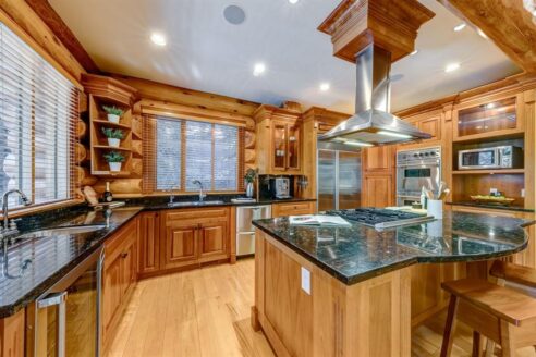 6361 Fairway Drive, interior and exterior views of this luxury log home.